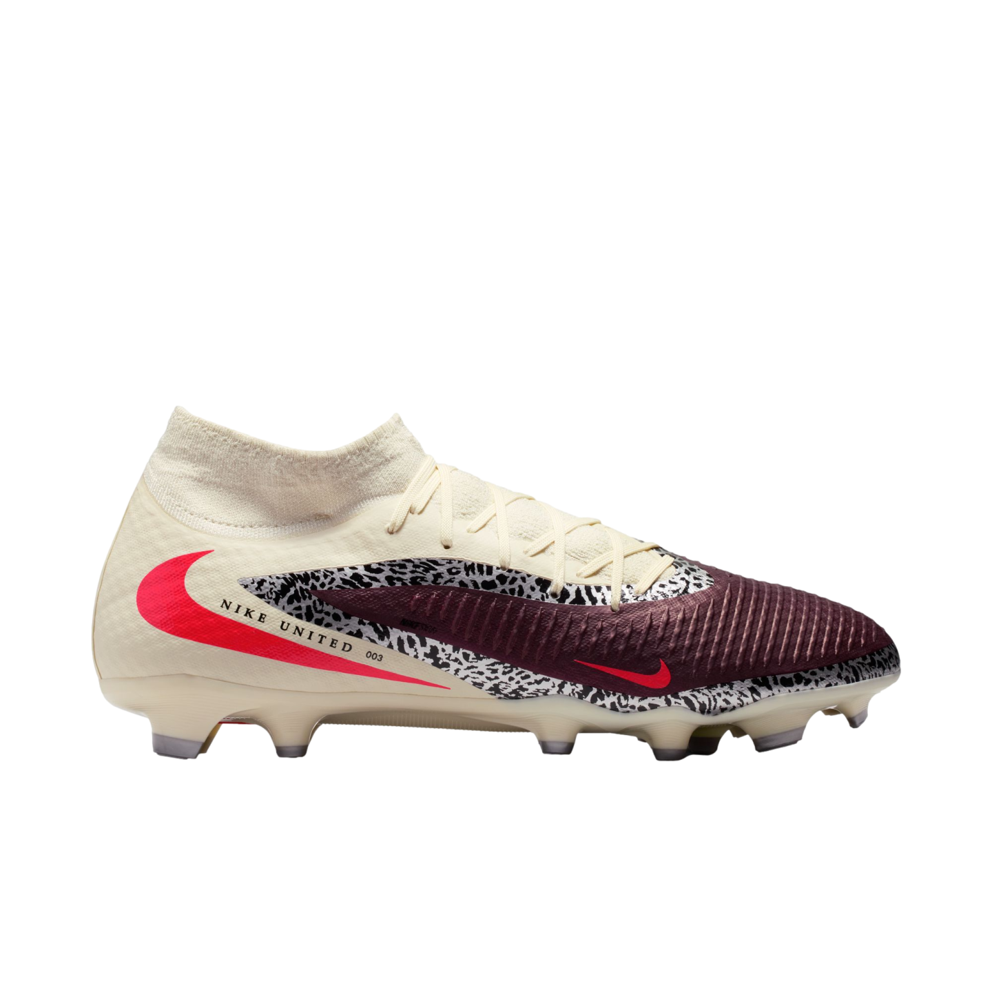 A side view of a Nike United soccer cleat featuring cream, maroon, and safari print panels with a large red swoosh, high-top collar, and "NIKE UNITED 003" text.