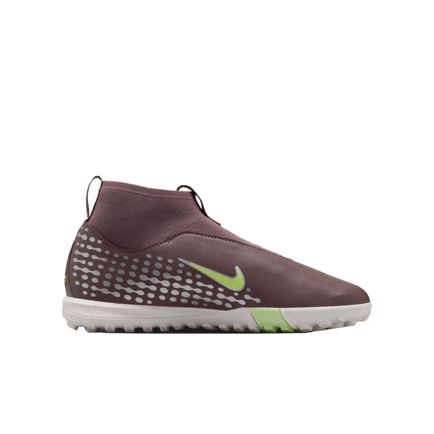 Side view of a mauve Nike soccer turf shoe with light green accents and a white speckled sole, isolated on a black background.