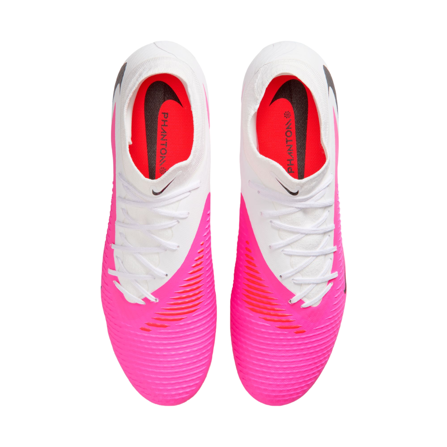 Top-down view of a pair of Nike Phantom soccer cleats featuring a white upper, a bright pink textured forefoot, and white laces against a plain white background.