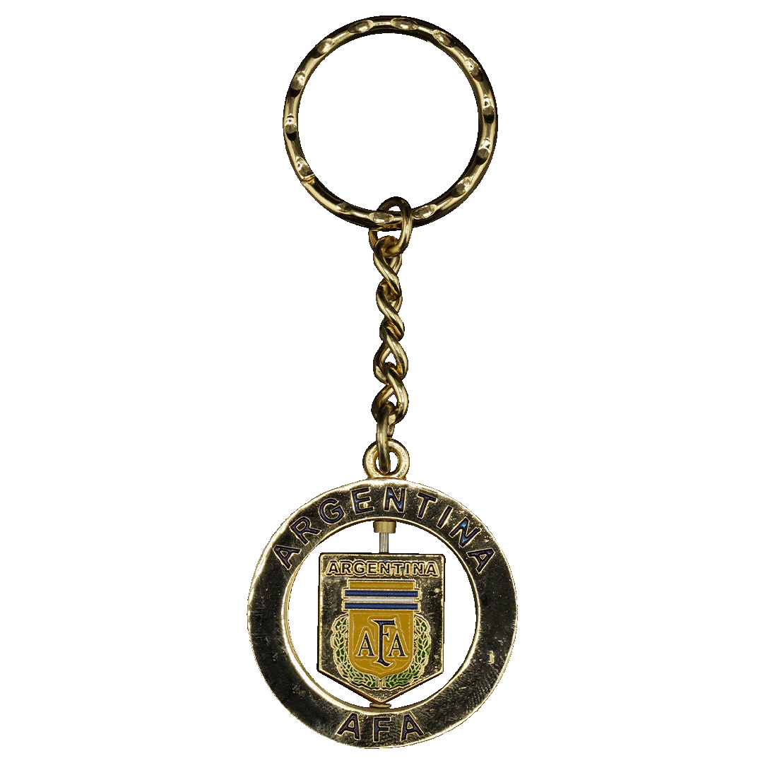 Gold-colored keychain featuring a spinning Argentine Football Association (AFA) shield logo within a circular frame engraved with "ARGENTINA" and "AFA".