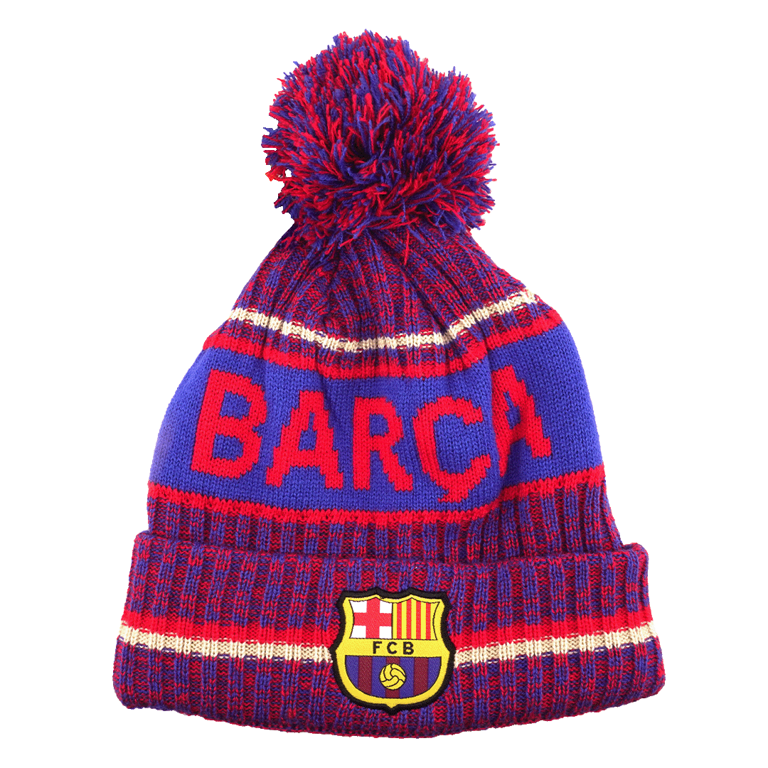 A blue and red knit FC Barcelona bobble hat featuring the word "BARÇA" in large red letters across the center and the official team crest on the folded brim.