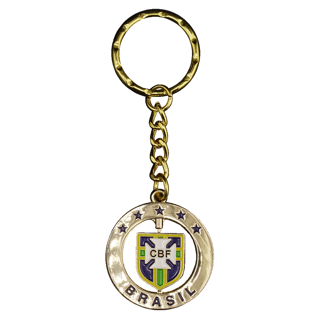 Gold keychain with the Brazilian Football Confederation (CBF) crest. A circular frame with stars and "BRASIL" surrounds a rotating shield featuring the CBF logo.