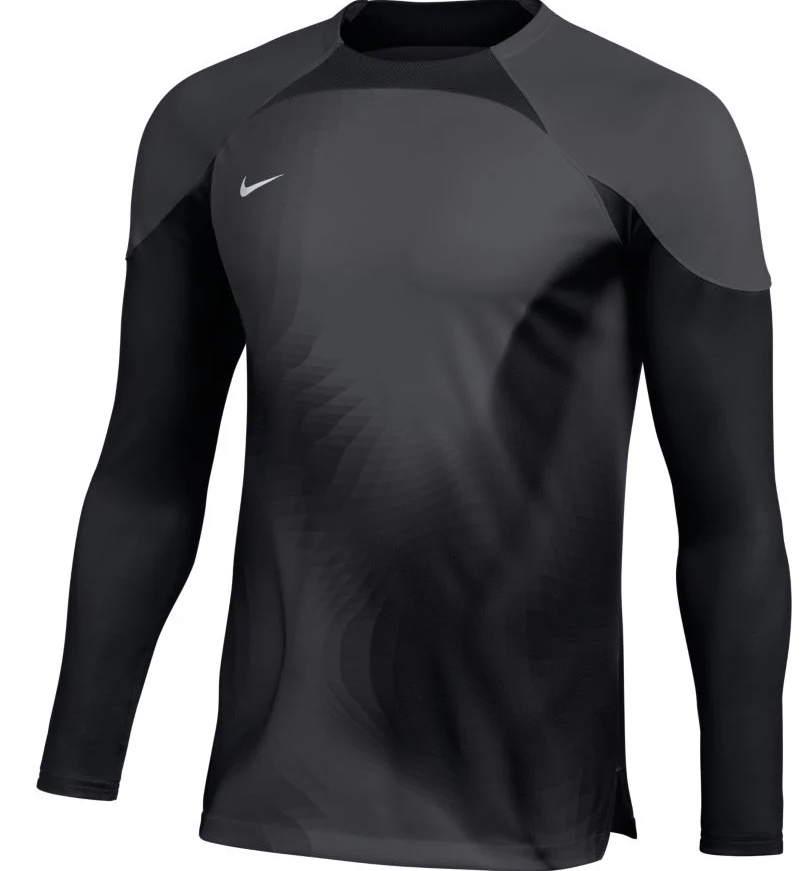 A long-sleeved Nike athletic shirt in shades of dark gray and black, featuring a tonal wavy pattern on the front and solid black sleeves.
