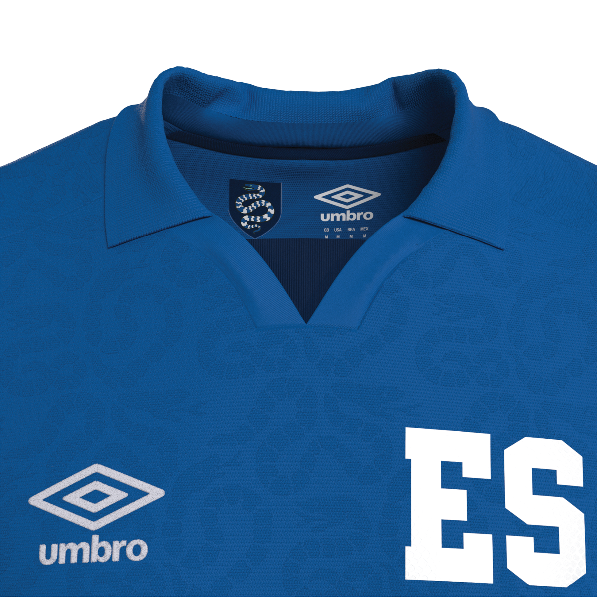 Close-up of a blue Umbro El Salvador national soccer team jersey featuring a collar, white Umbro logo, and large white "ES" block letters on the chest.