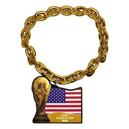 A chunky gold-colored link chain with a pendant featuring the FIFA World Cup trophy next to the United States flag and the text "FIFA WORLD CUP 26."