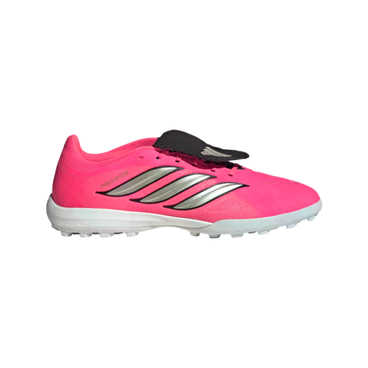 Side profile of a pink Adidas Predator football boot with silver stripes, a black fold-over tongue, and a white studded turf sole.