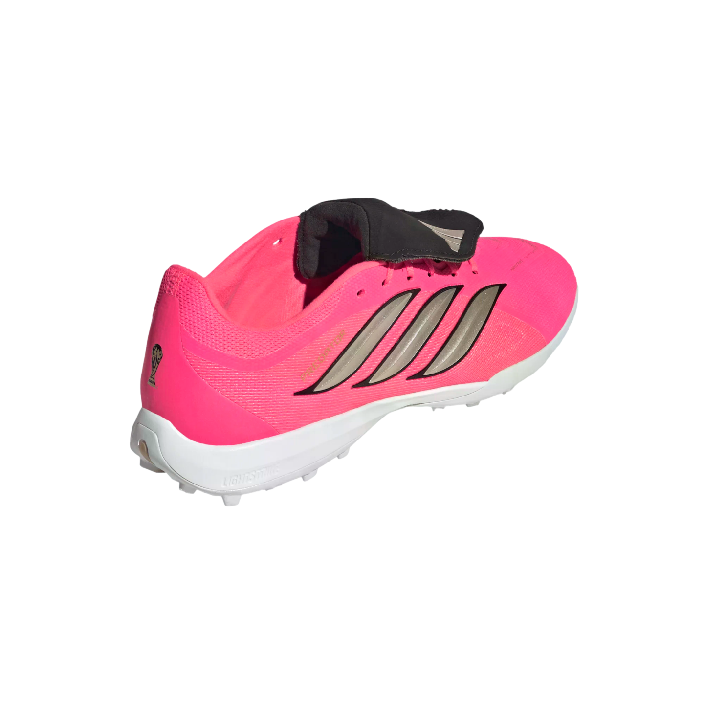 Three-quarter rear view of a bright pink Adidas soccer shoe with silver stripes, a black fold-over tongue, and a white studded sole against a plain white background.