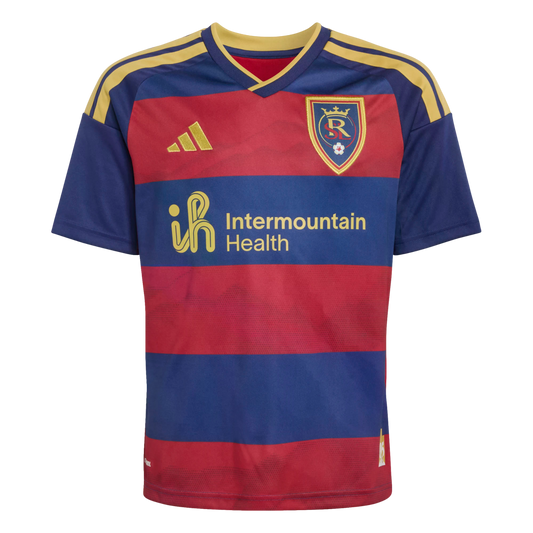 A red and navy blue striped Real Salt Lake soccer jersey featuring gold Adidas logos, shoulder stripes, and the Intermountain Health sponsor.