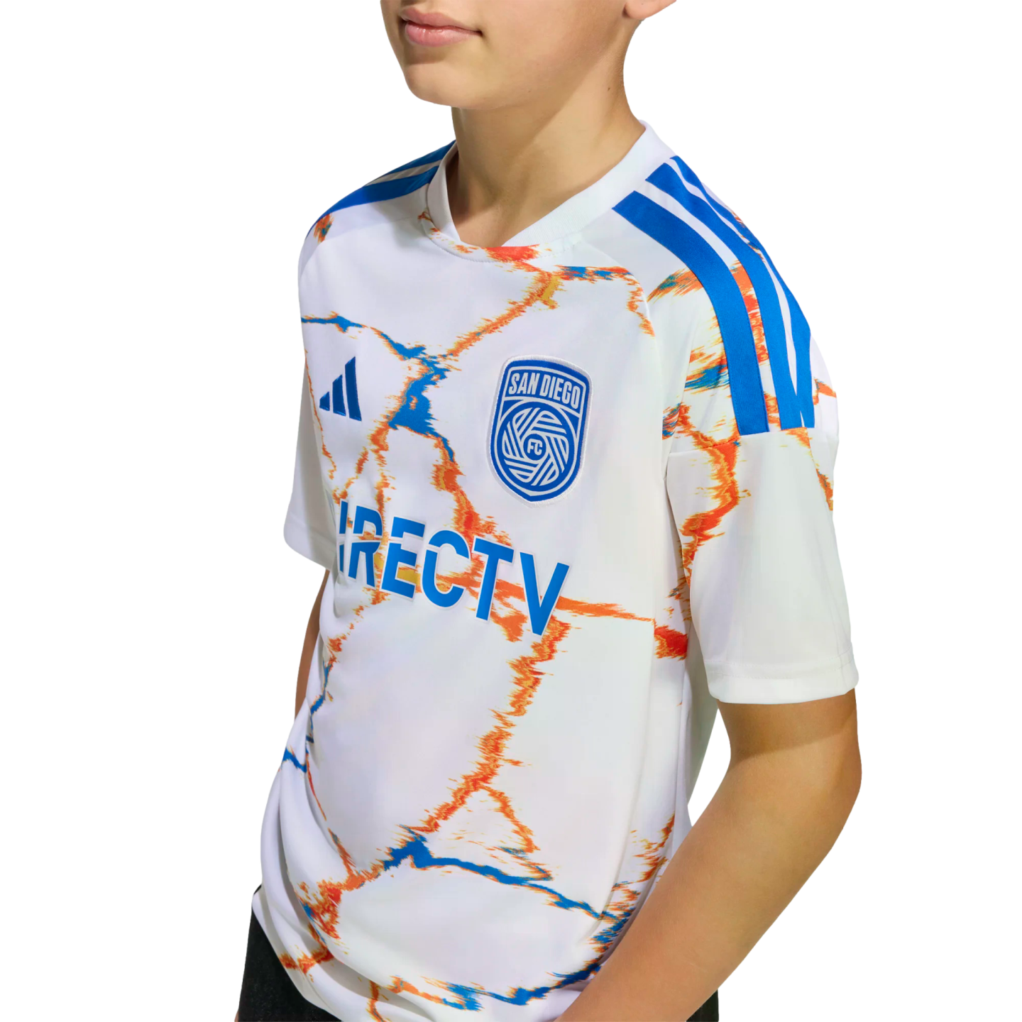 A youth wearing a white soccer jersey with an orange and blue marbled pattern, featuring the San Diego FC crest and DIRECTV logo on the chest.
