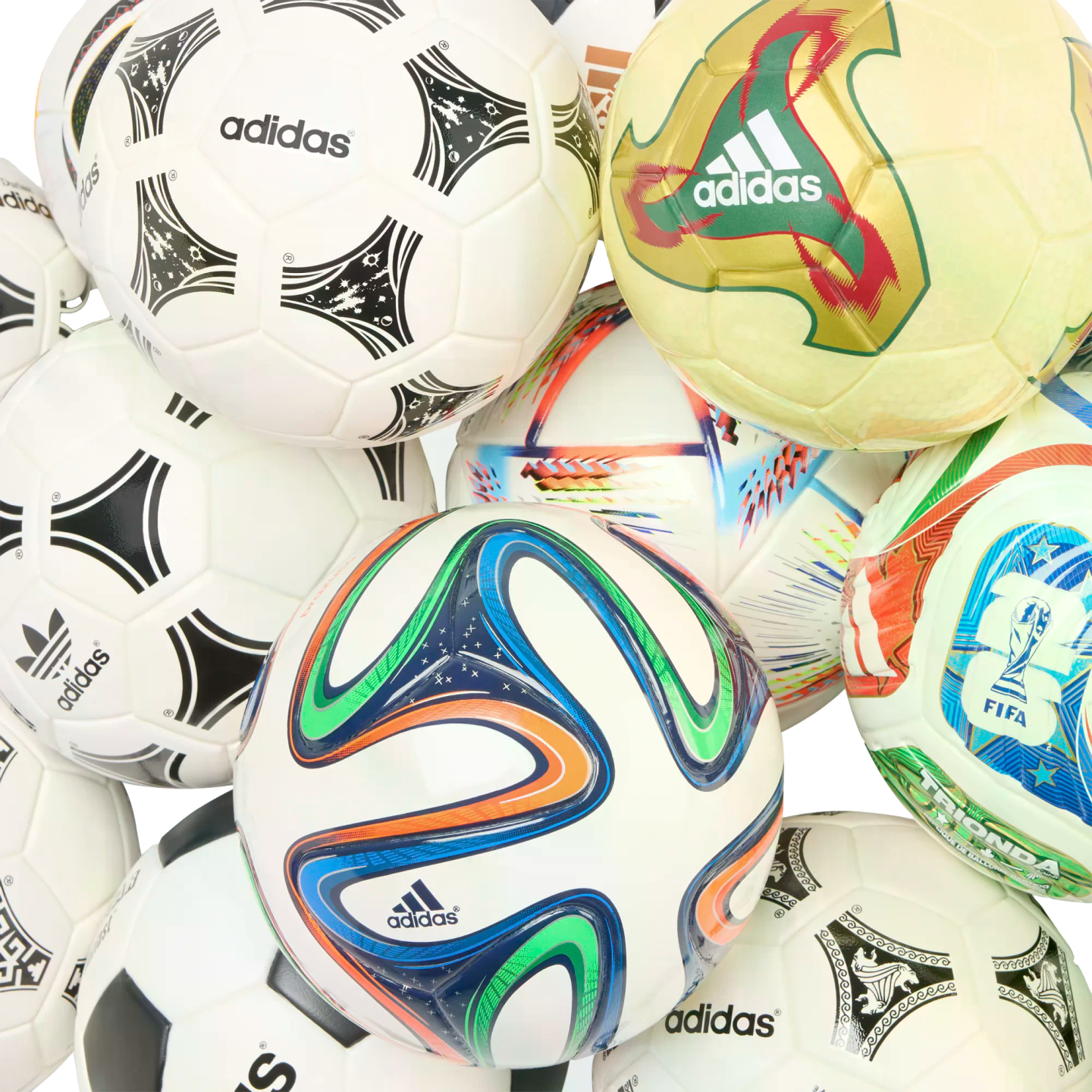 A pile of various Adidas soccer balls with different designs and patterns, including some from past World Cup tournaments.