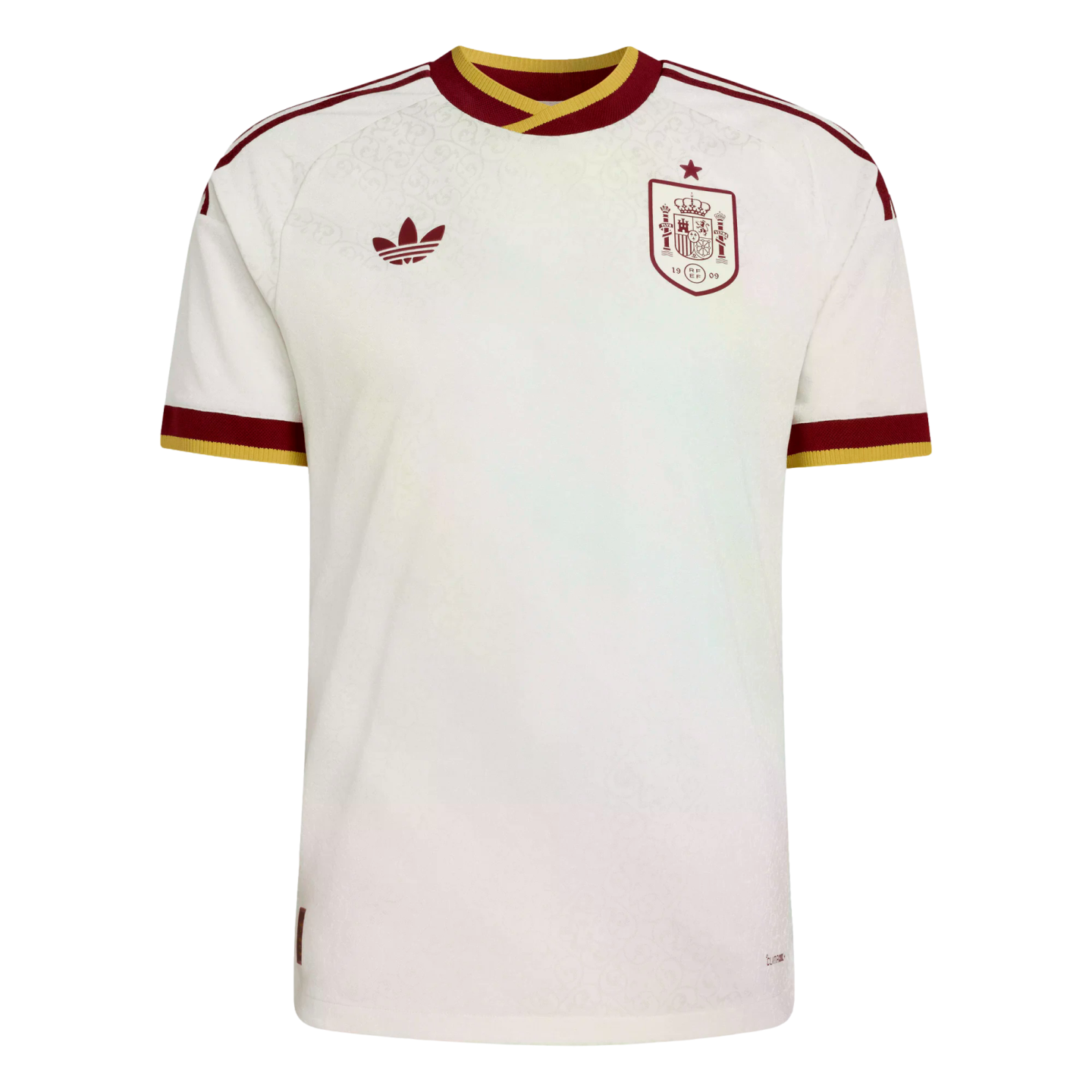 A white Adidas Spain national football team jersey with burgundy and gold trim, featuring a subtle floral pattern, trefoil logo, and national team crest.