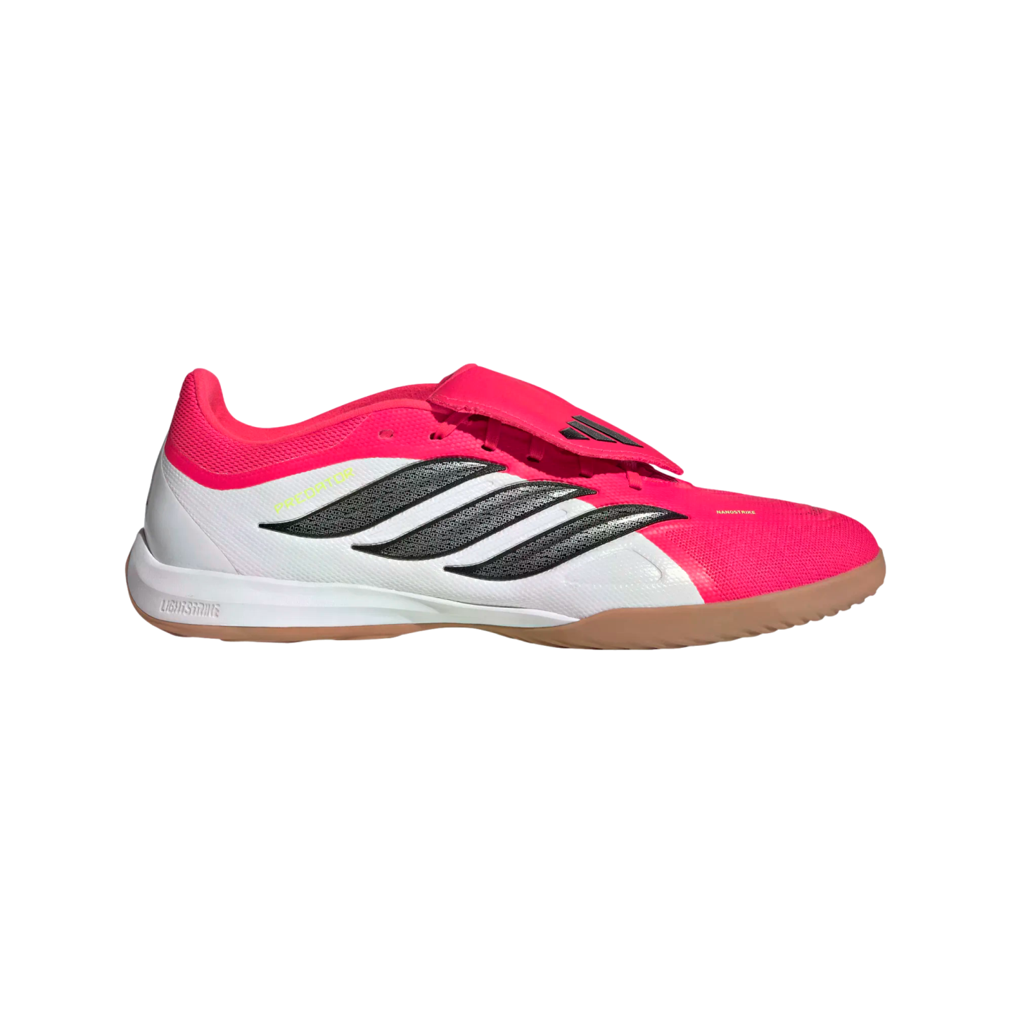 A pink and white Adidas Predator indoor soccer shoe featuring three black stripes, a fold-over tongue, and a tan gum rubber sole.