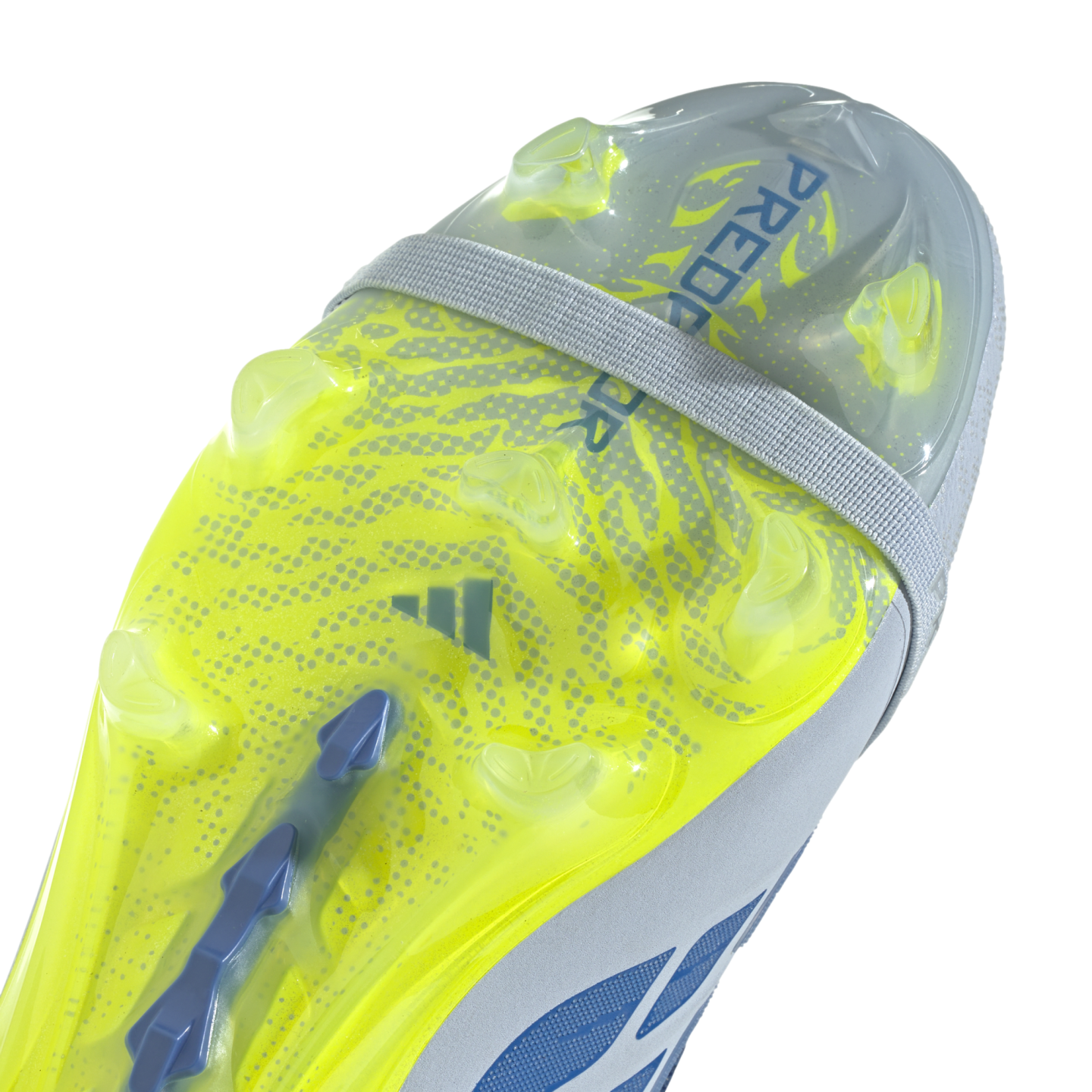 A close-up view of the neon yellow patterned outsole of an Adidas Predator soccer cleat, showing its various studs and a grey elastic strap against a solid black background.