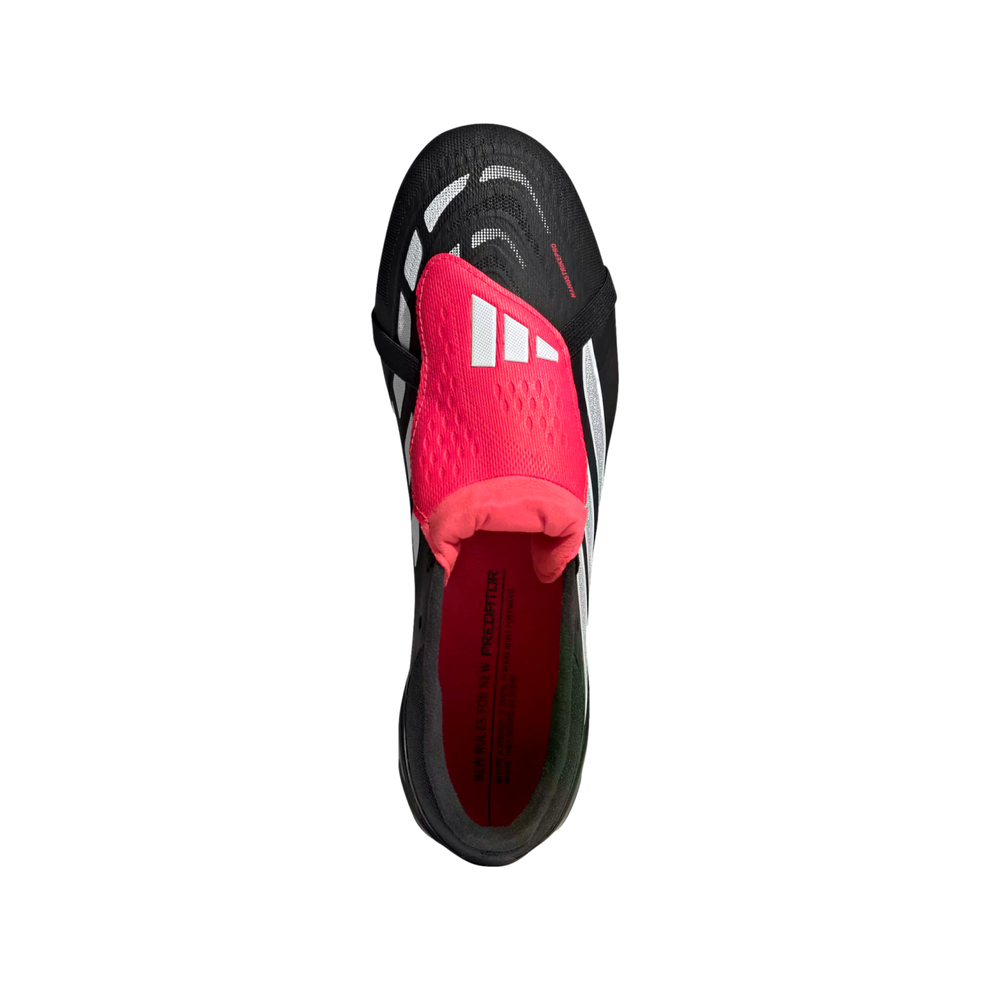 Top-down view of a black Adidas Predator soccer cleat featuring a prominent pink fold-over tongue and white accents against a solid black background.