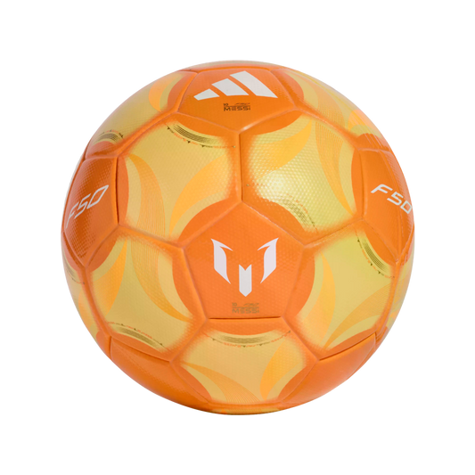 A soccer ball featuring orange and yellow panels and white logos, including the Adidas three-stripe logo and the Lionel Messi "M" branding, against a solid black background.