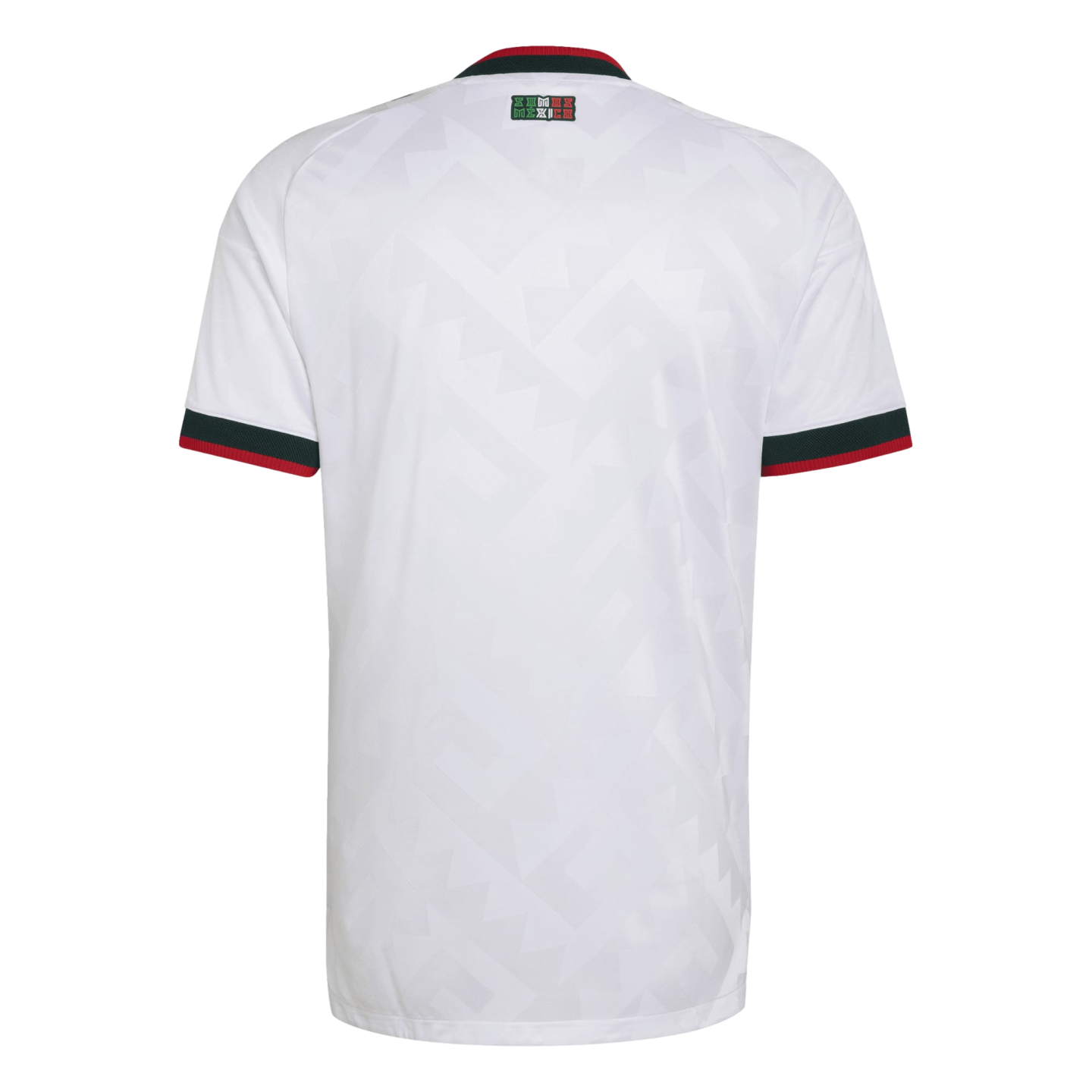 Rear view of a white jersey with green and red striped collar and cuffs, a subtle geometric pattern, and a small "SOMOS MEXICO" patch on the upper back.