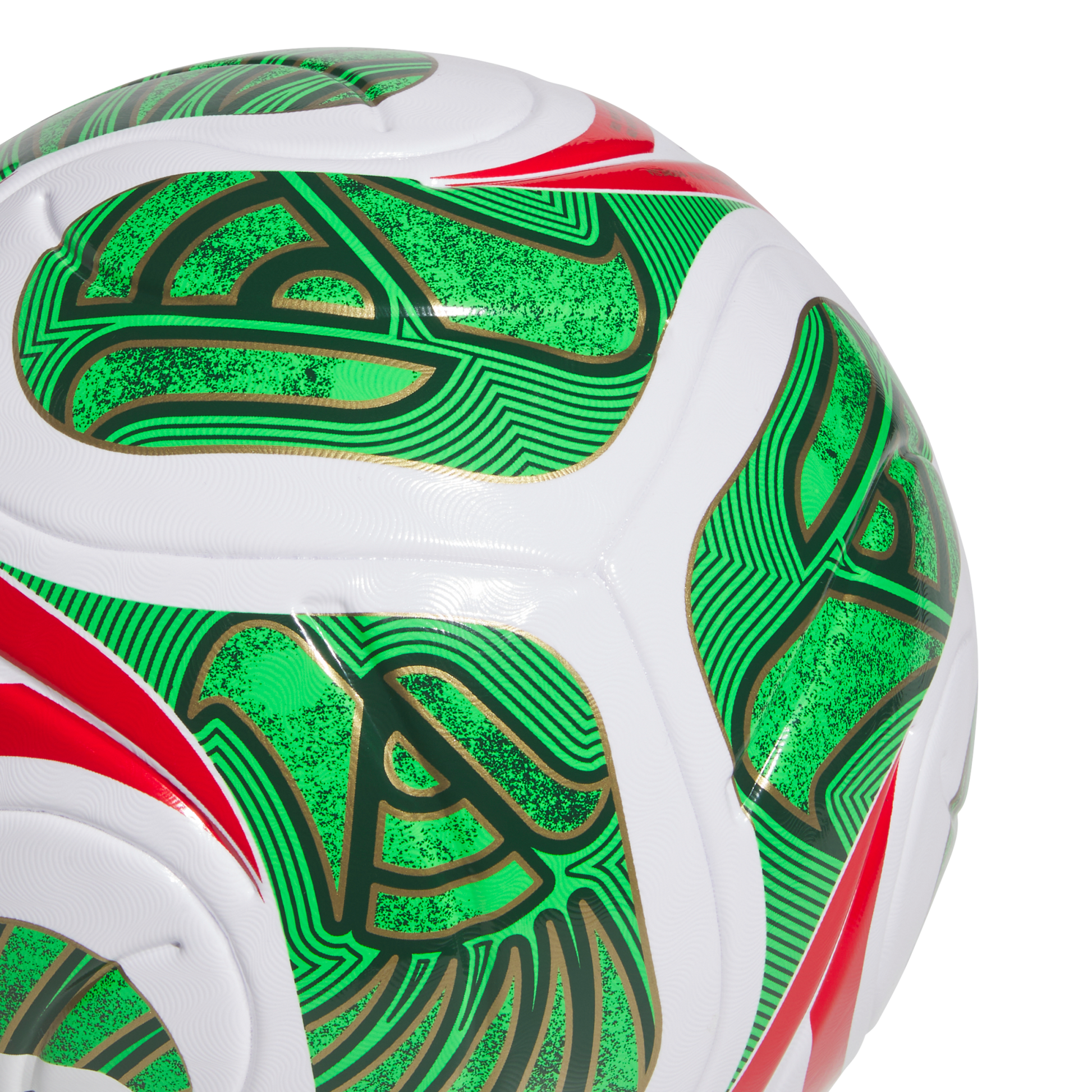 A close-up of a white soccer ball featuring intricate green and red patterns with gold outlines against a solid black background.