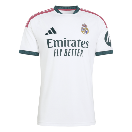 A white Real Madrid home soccer jersey featuring a teal-patterned collar and cuffs, pink shoulder stripes, and the "Emirates FLY BETTER" sponsor logo.