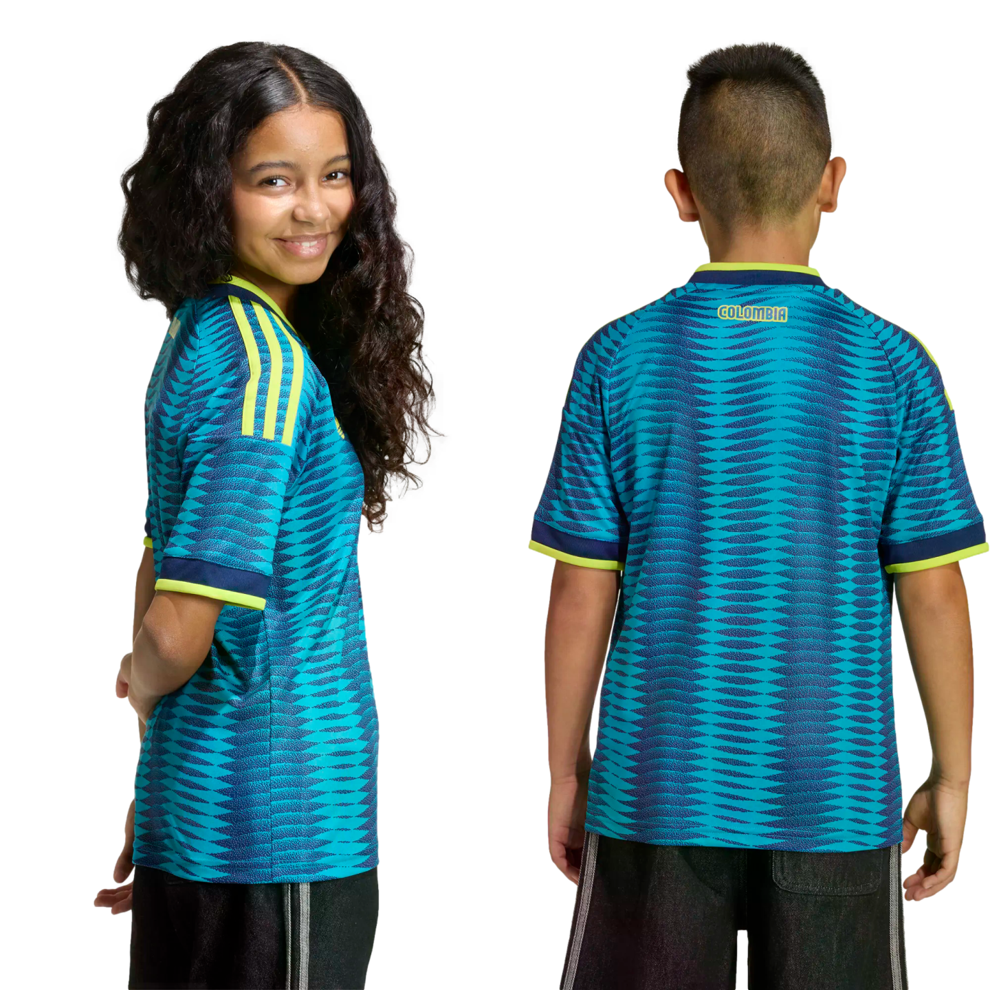 A girl and boy wearing teal and navy patterned Colombia soccer jerseys with yellow trim. One smiles at the camera; the other shows the back view with "COLOMBIA" on the neck.