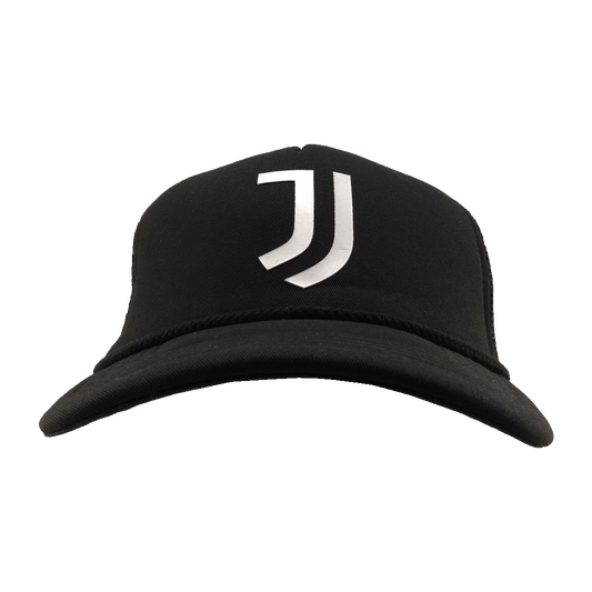 A black baseball cap with a white Juventus logo on the front, set against a solid green background.
