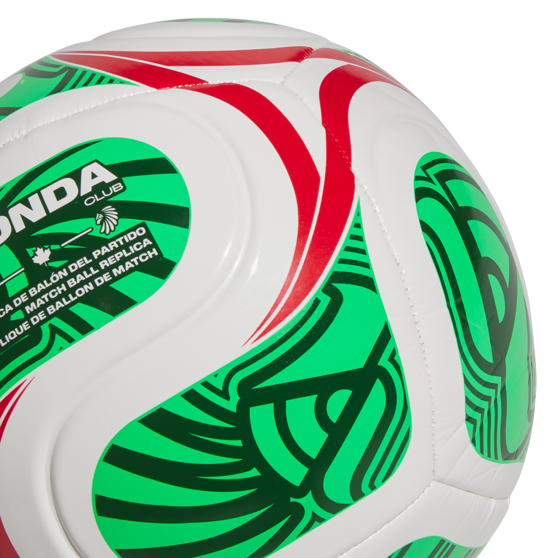 Close-up of a white soccer ball with green and red patterns, featuring "MATCH BALL REPLICA" text and an indigenous-style logo.