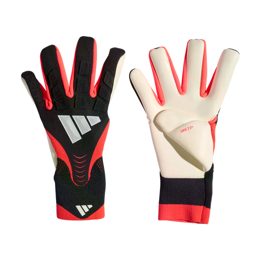 Adidas goalkeeper gloves in black, red, and white, showing both the textured backhand and the white palm with "URG 2.0+" branding.