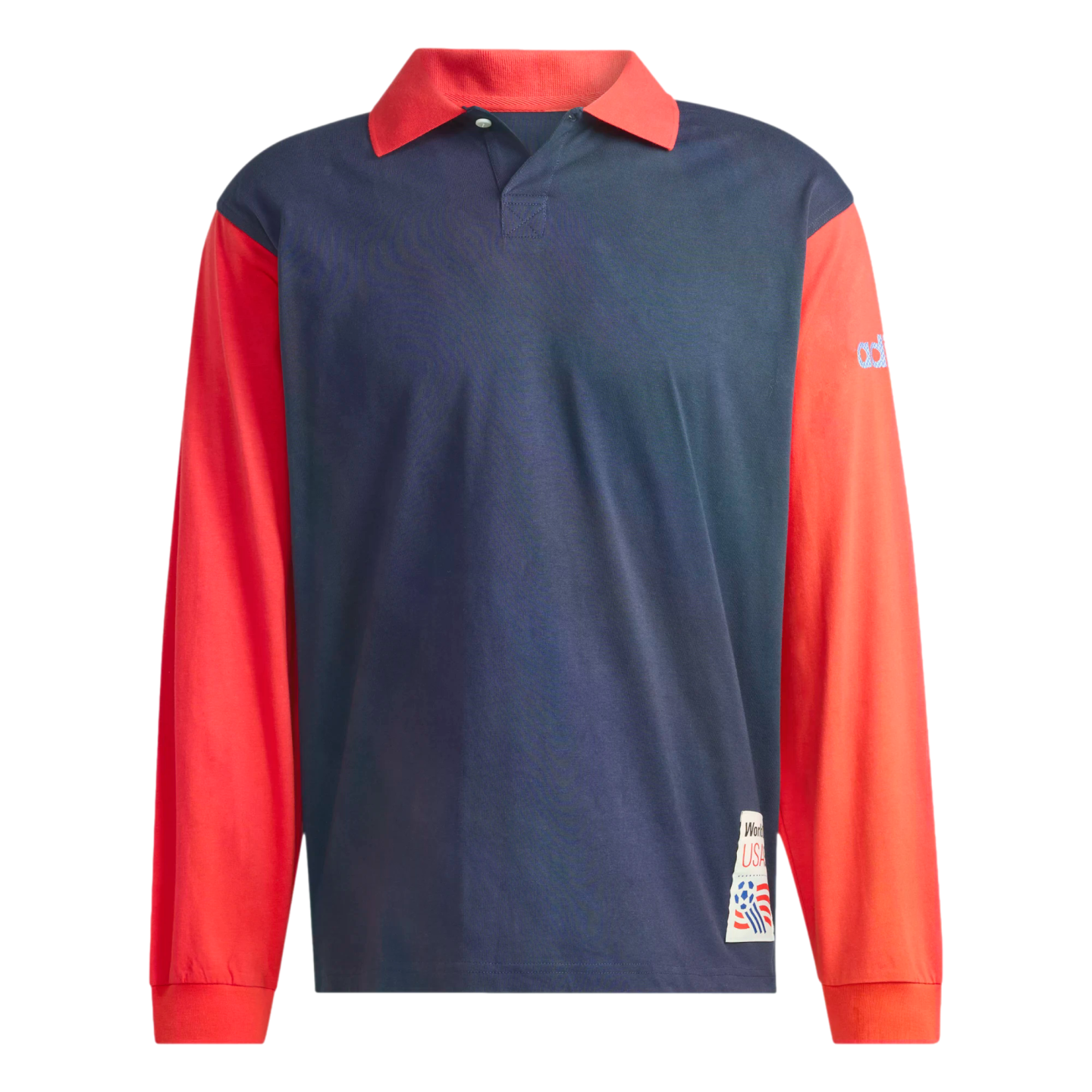 A long-sleeved polo shirt with a navy blue body and contrasting bright red sleeves and collar. The shirt features a World Cup USA 94 patch on the lower front corner and a blue Adidas logo on the upper left sleeve.
