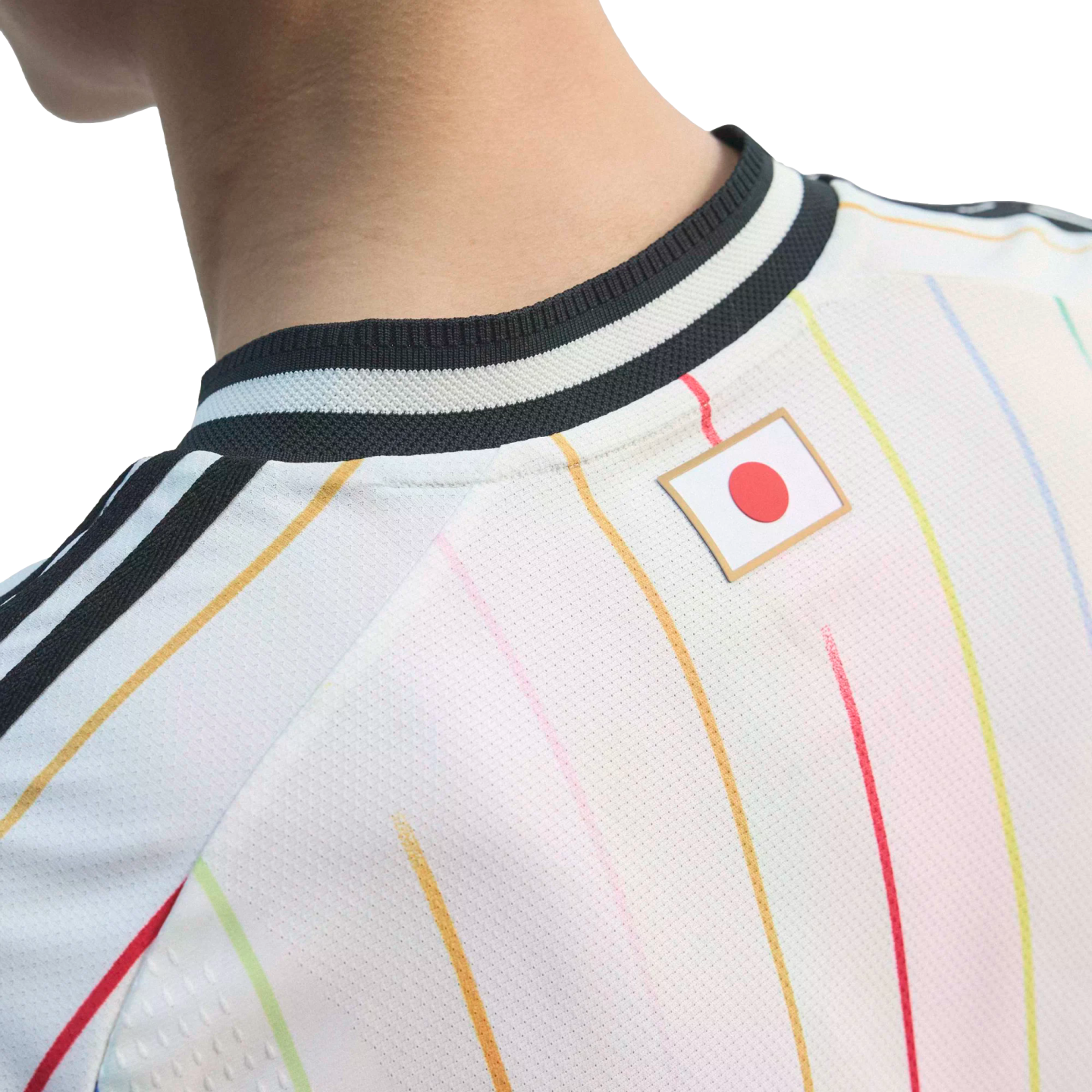 Close-up of the back of a white sports jersey with colorful pinstripes and a Japanese flag patch below a black-and-white ribbed collar.