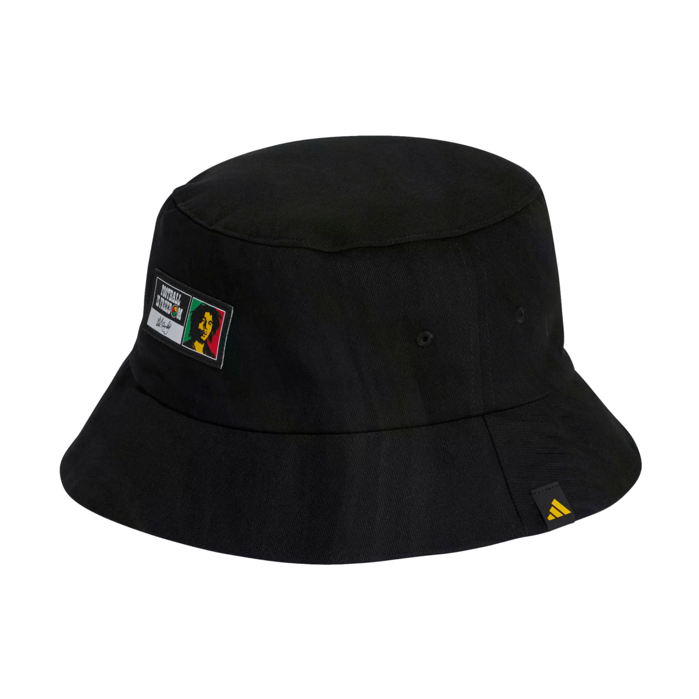 A black bucket hat featuring a patch with Bob Marley and the words "Football is Freedom," and a small yellow Adidas logo tag on the brim.