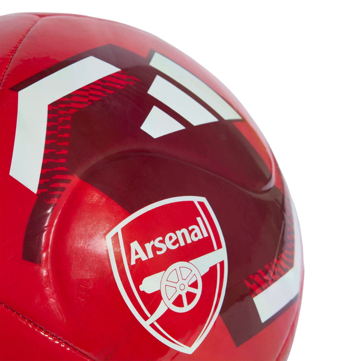 Close-up of a red Adidas soccer ball featuring the Arsenal Football Club crest.