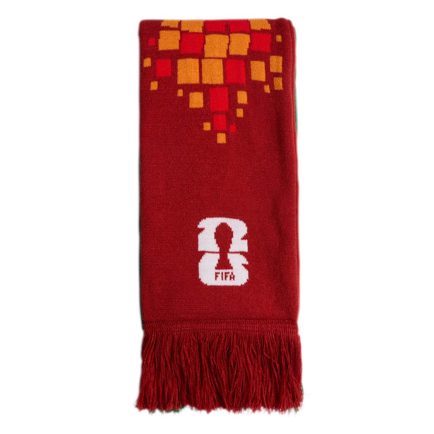 A red scarf featuring an orange and yellow square pattern, a white FIFA 26 logo, and red fringe at the bottom.