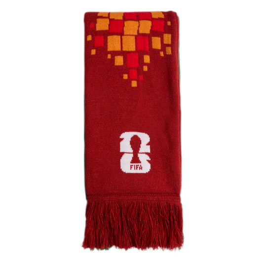 A red scarf featuring an orange and yellow square pattern, a white FIFA 26 logo, and red fringe at the bottom.