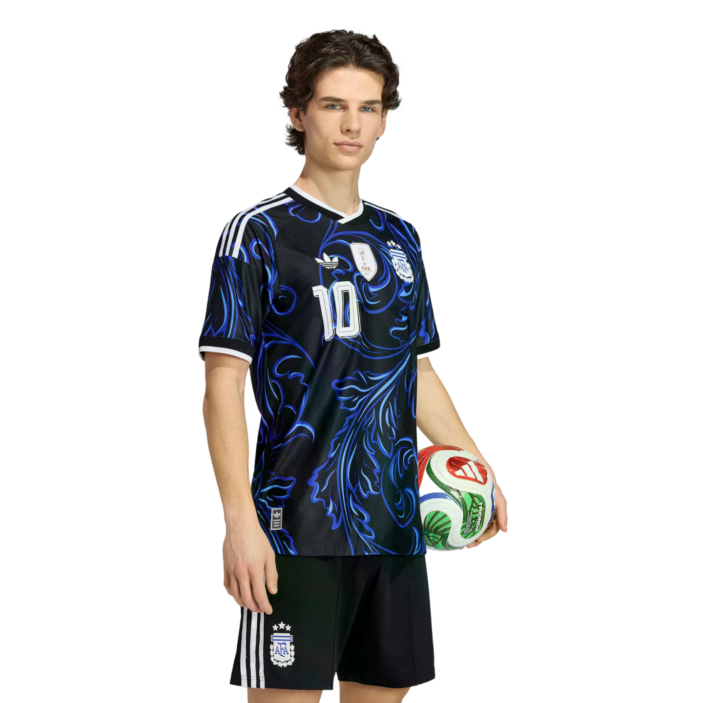 A young man wearing a black and blue patterned Argentina soccer kit with the number 10, holding a soccer ball against a black background.
