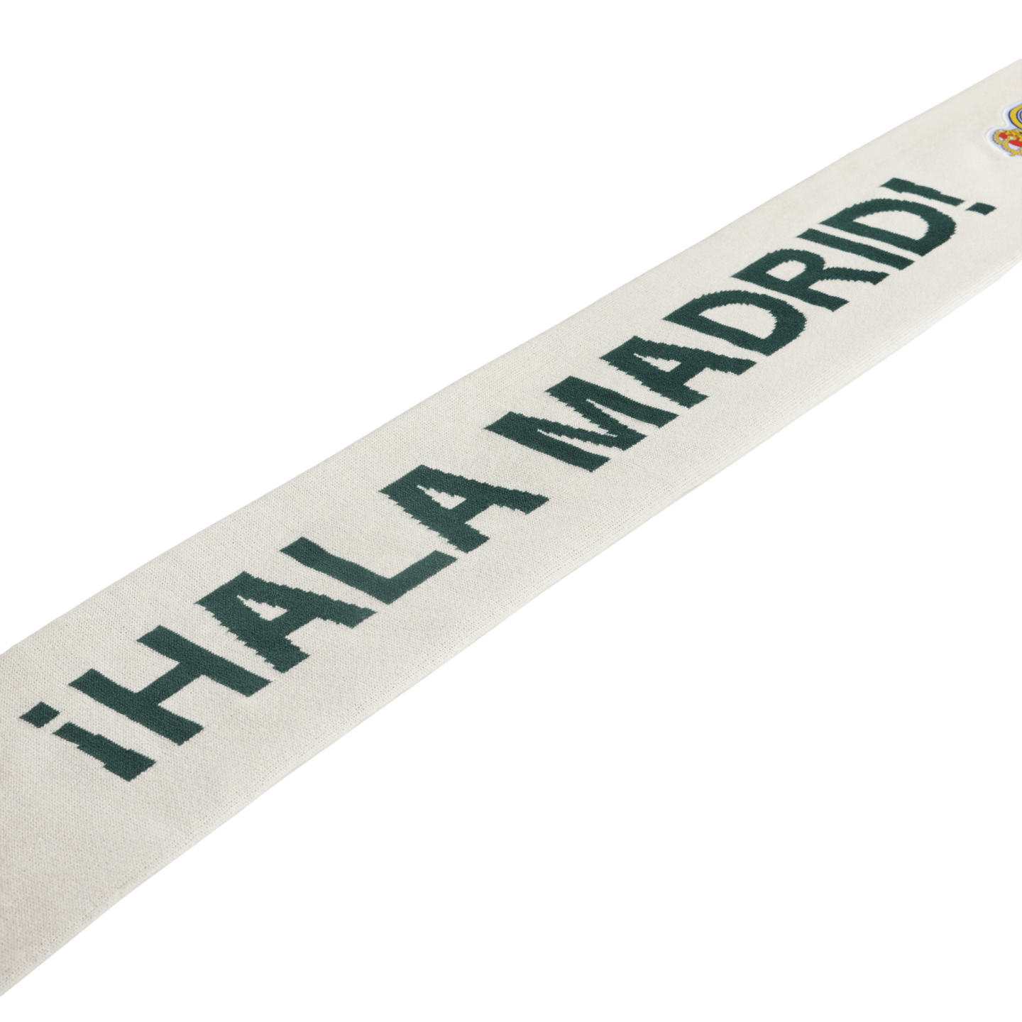 White scarf with dark green "¡HALA MADRID!" text and a small Real Madrid crest.
