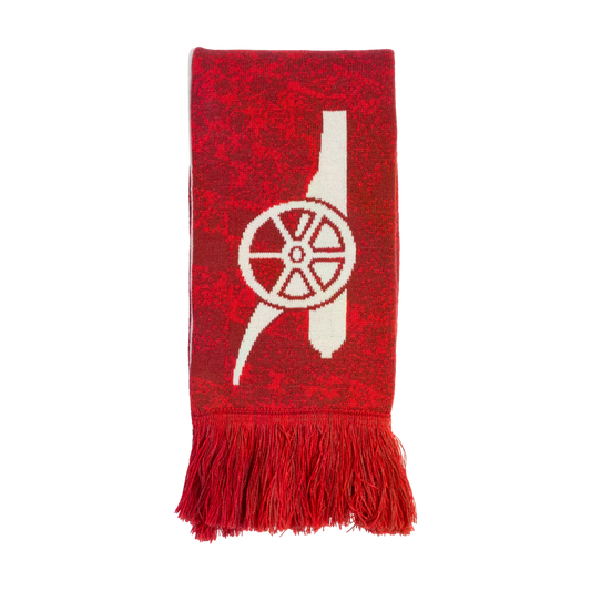 A red mottled knit scarf featuring a large white cannon logo and red fringes at the bottom.