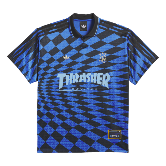 Blue and black checkered Adidas polo shirt featuring gold AFA and trefoil logos, and a large light blue "Thrasher Revista" graphic across the front.