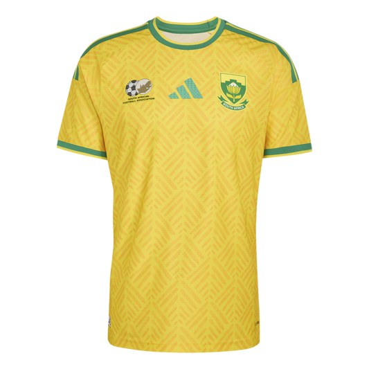 A yellow South African national soccer jersey with green trim, featuring the team crest, Adidas logo, and SAFA emblem on a textured chevron pattern.