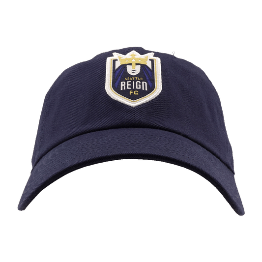 Navy blue baseball cap featuring the Seattle Reign FC crest on the front, set against a solid green background.