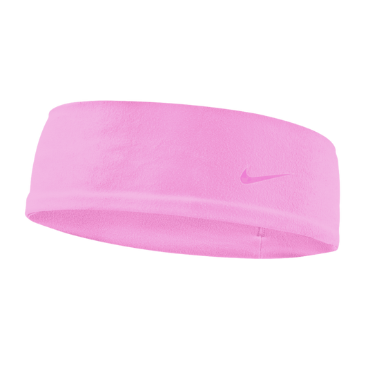 A light pink Nike fleece headband with a small matching swoosh logo on the right side, set against a black background.