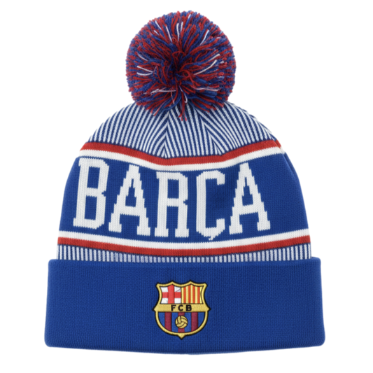 Blue and white striped knit beanie featuring a pom-pom, large "BARCA" lettering, and the FC Barcelona crest on the folded cuff.