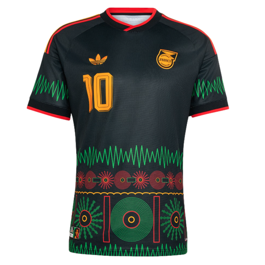 Black Adidas Jamaica soccer jersey with gold number 10, green zigzag accents, and colorful cultural graphics on the lower half.