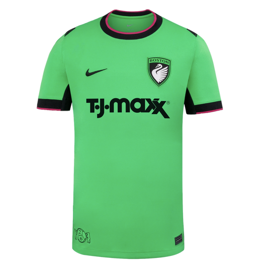A bright green Nike soccer jersey featuring a T.J.Maxx sponsor logo, a Boston swan crest, and black and pink trim on the collar and sleeve cuffs.