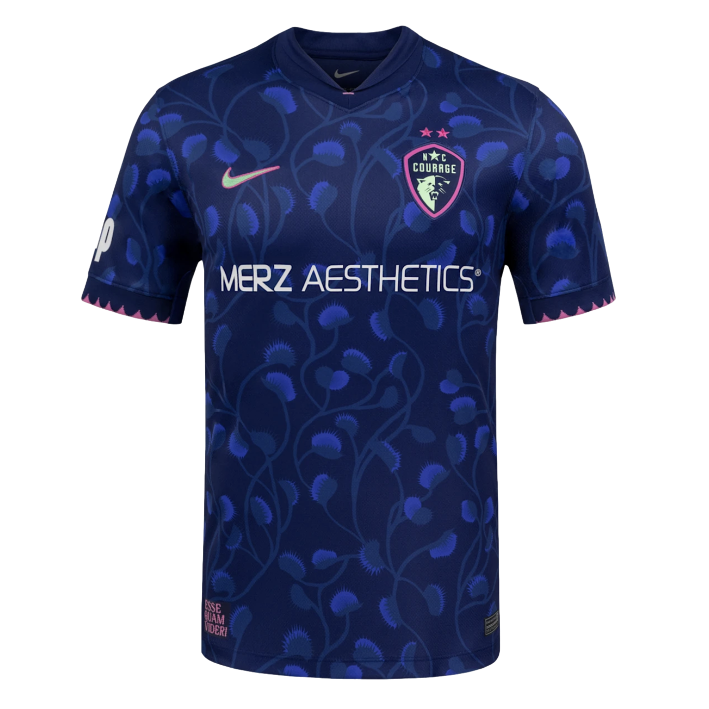 Navy soccer jersey with blue Venus flytrap patterns, white Merz Aesthetics text, a pink Nike swoosh, and NC Courage crest. Jagged pink trim lines the sleeve cuffs and bottom hem.