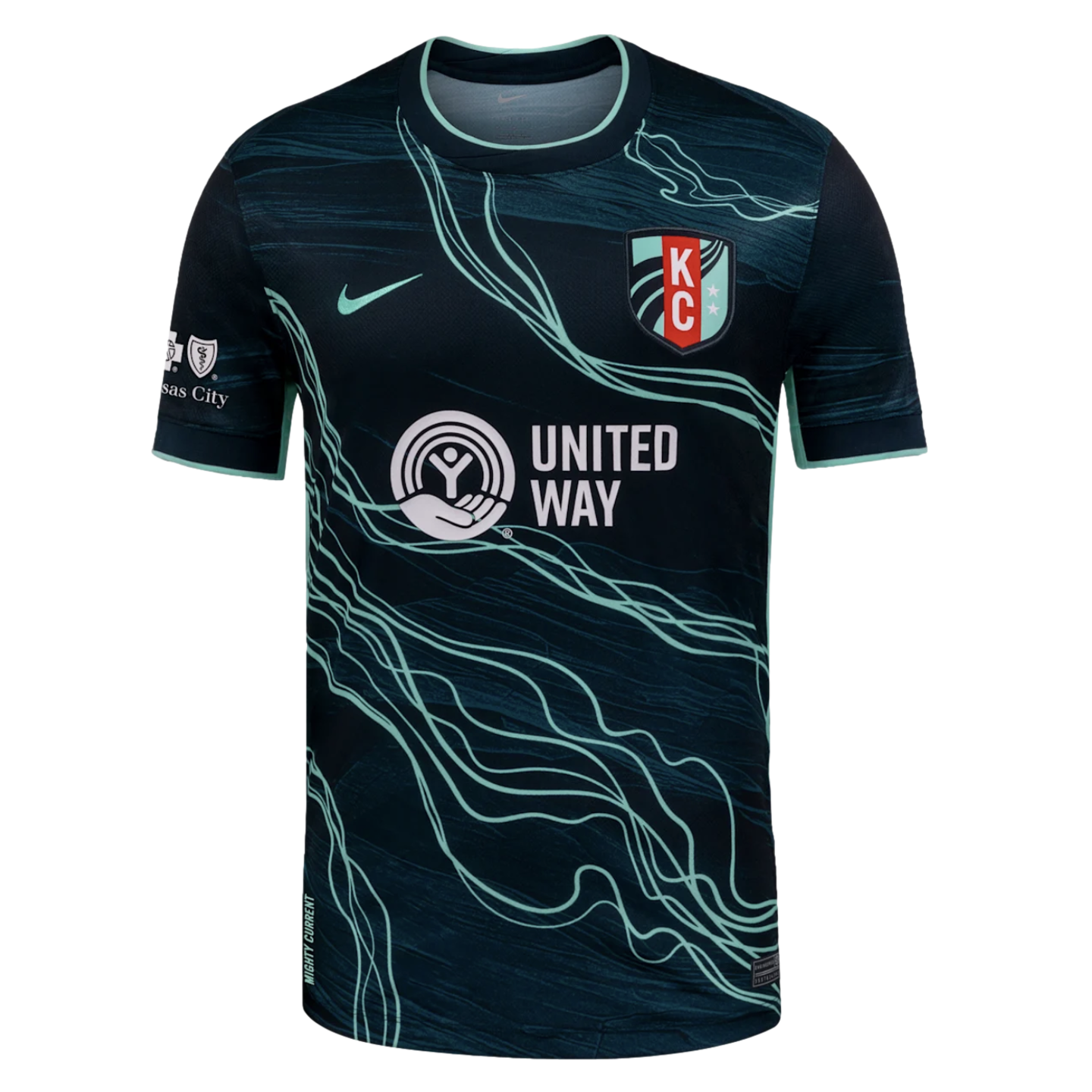 Navy soccer jersey with teal wavy lines, Nike logo, KC team crest, and white United Way sponsor logo. Teal accents on collar and cuffs.