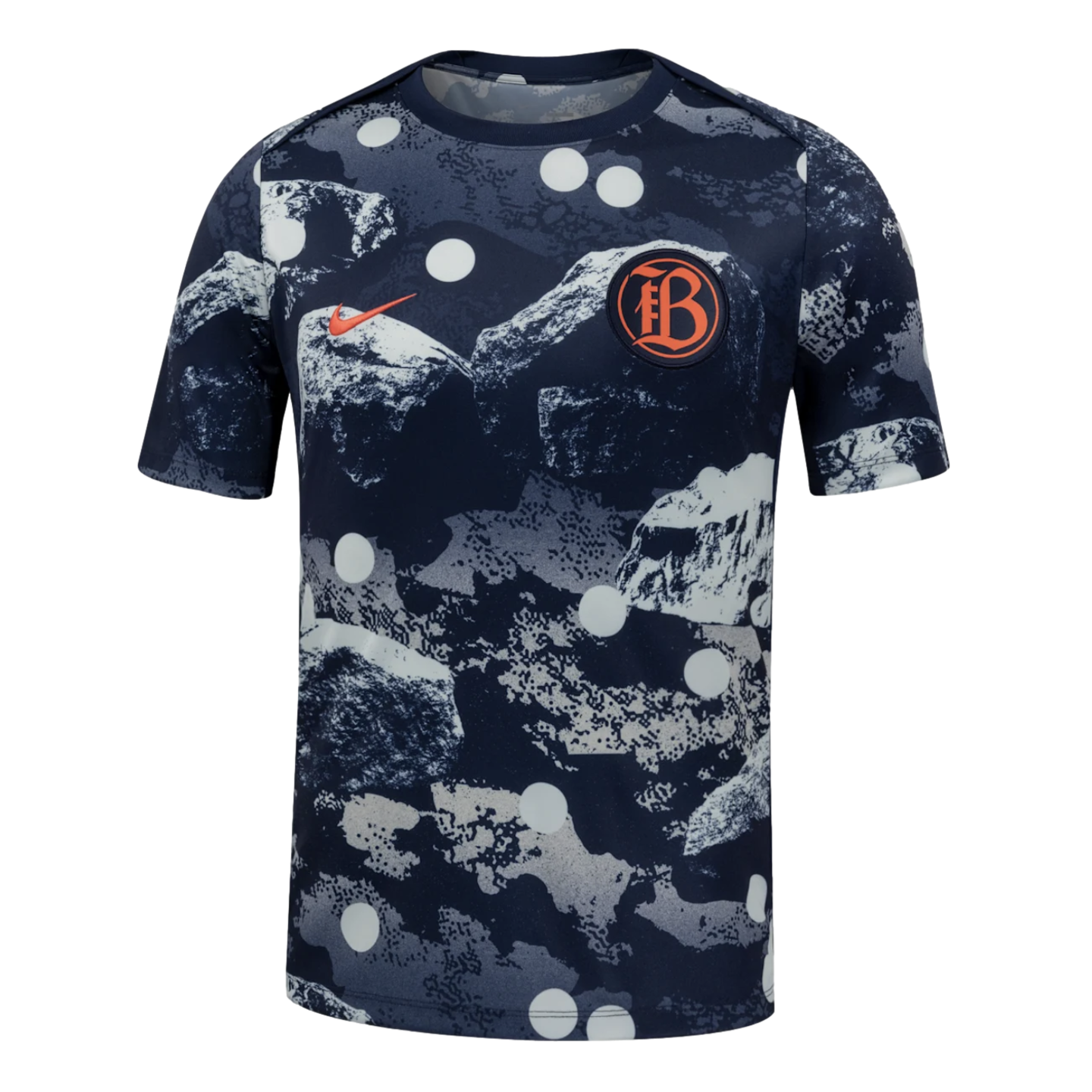 Nike short-sleeve athletic top with a navy and grey rocky camo print, white polka dots, an orange swoosh, and a circular "FB" crest on the chest.