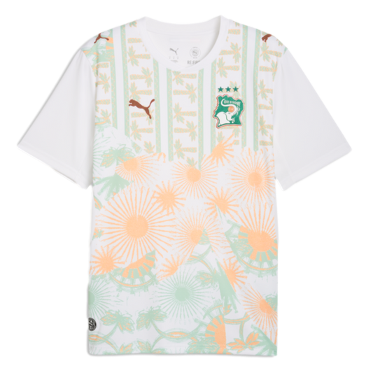 White Puma Côte d’Ivoire soccer jersey featuring a green and orange tropical pattern with palm trees, sunbursts, and the national team crest.