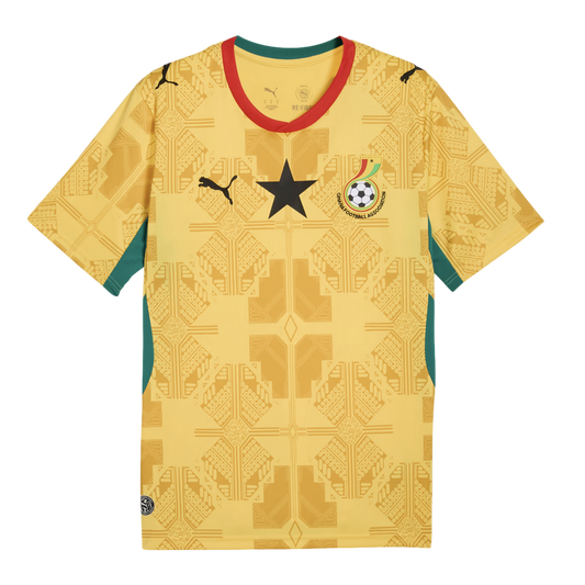 A yellow Ghana national team football jersey featuring a subtle tone-on-tone geometric pattern, a large black star on the center chest, the Puma logo, and the Ghana Football Association crest. The jersey has red and green trim on the collar and side panel