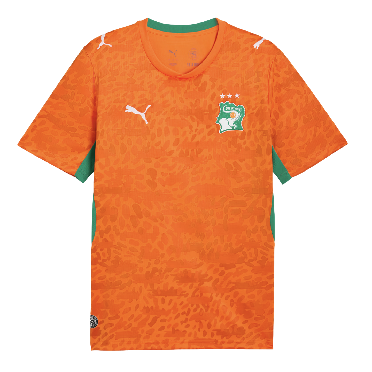 An orange Puma soccer jersey for the Côte d'Ivoire national team. It features an all-over tonal leopard print pattern, a green collar, and green side panels. The team's elephant crest with three stars is on the left chest, and white Puma logos are on the 