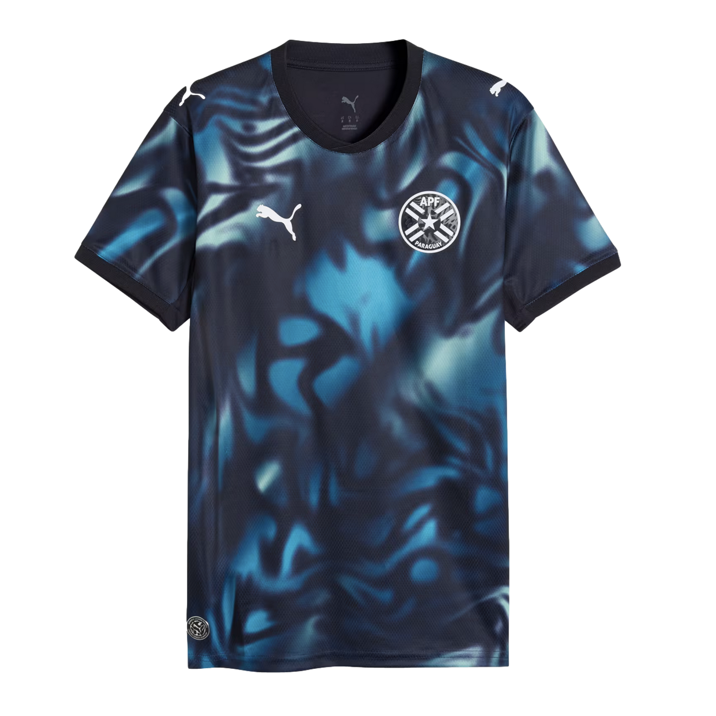 Puma Paraguay national team soccer jersey featuring a dark navy and blue abstract swirl pattern, white Puma logos, and the APF team crest.