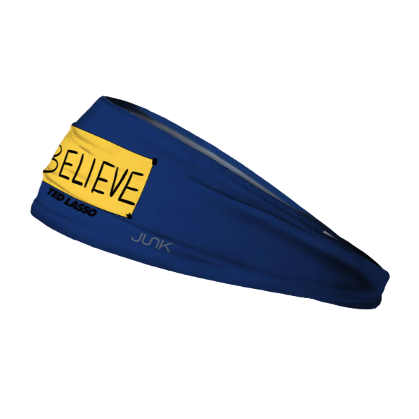 A navy blue Junk headband featuring a yellow "BELIEVE" sign and "TED LASSO" text, shown at an angle against a black background.